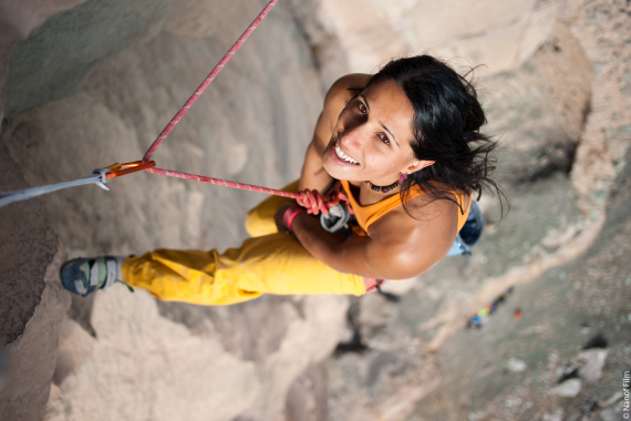 Climber Nasim Eshqi abseils down a rock face