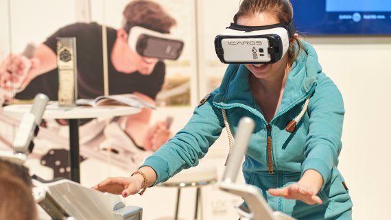 A women wearing virtual reality glasses.