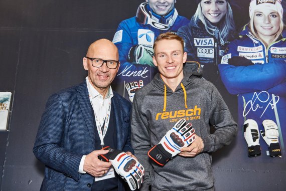 CEO of Messe München Klaus Dittrich with ski racer Henrik Kristofferson (right)