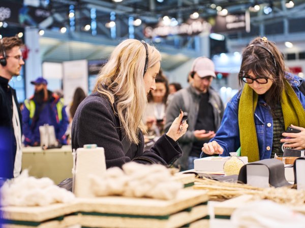 Two women look at various sustainable and innovative materials in the Material Lab at the Sustainability Hub