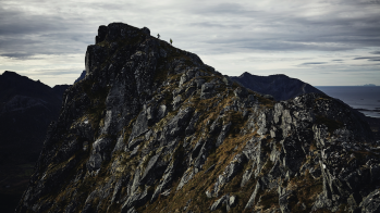 Climber on mountain ridge Climber on mountain ridge