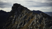 Climber on mountain ridge Climber on mountain ridge