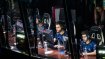 eSport players are in a competition and are focused on their monitors.