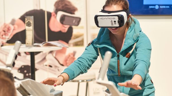 A women wearing virtual reality glasses.