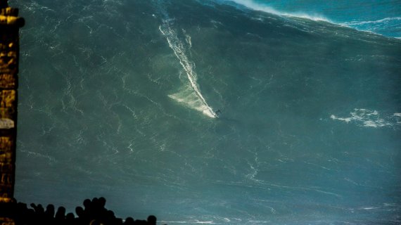 Sebastian Steudtner surfing a mega wave Almost goes down in the photo: Sebastian Steudtner surfing a mega-wave.